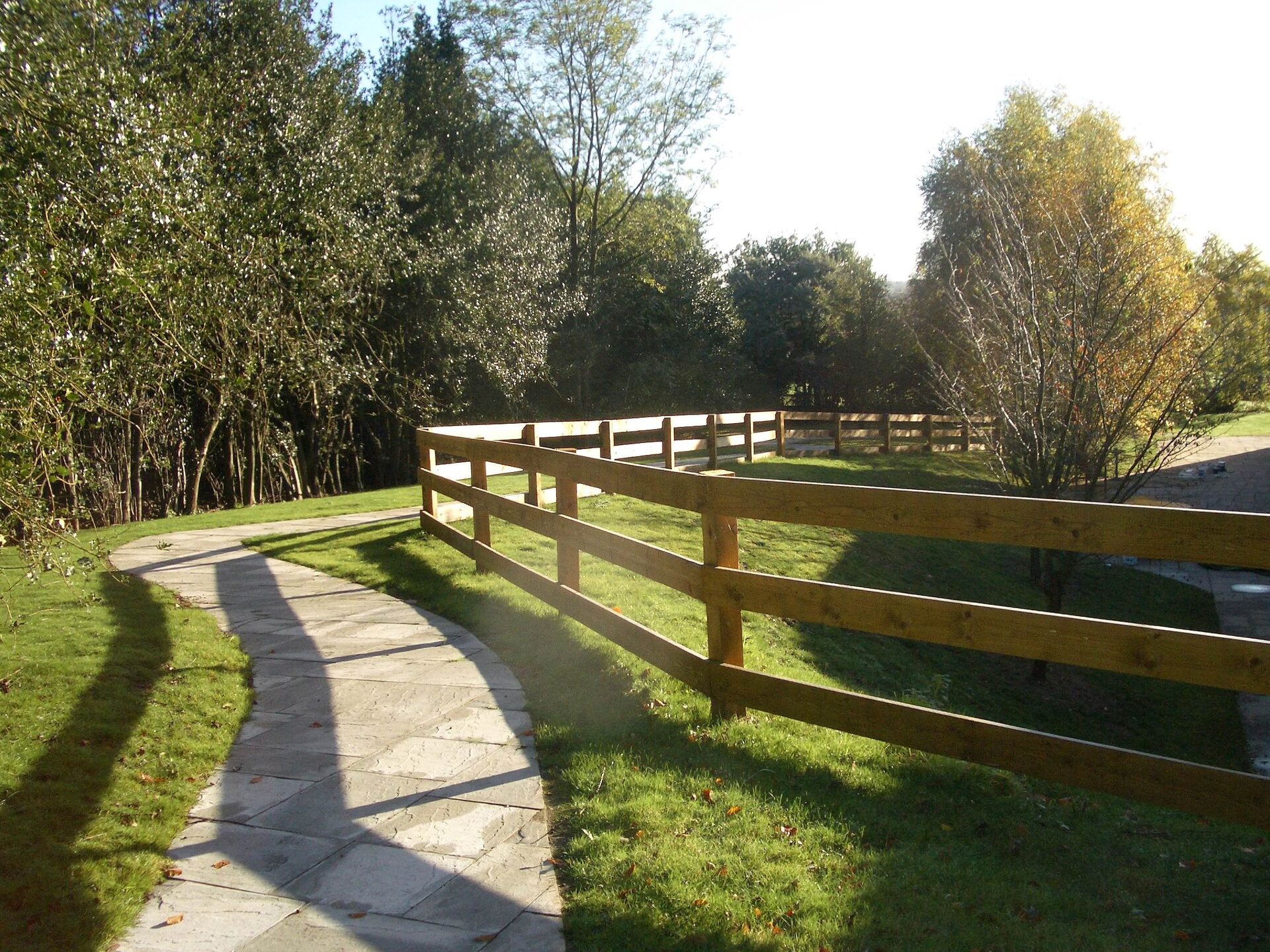 Paved garden walkway winding through the grounds at Aldridge Court